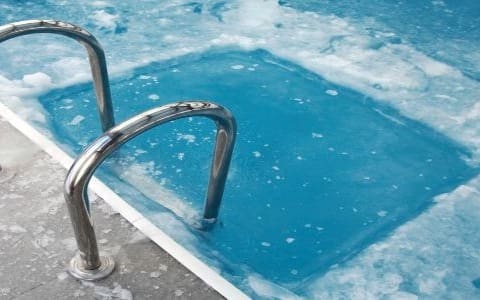 A swimming pool with a ladder